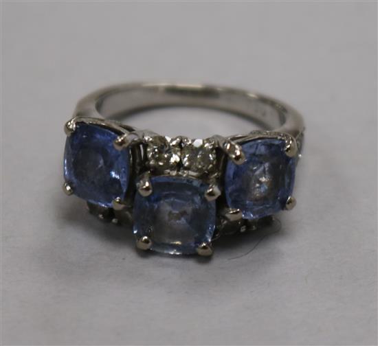 An 18ct gold and graduated princess cut diamond half hoop ring, set with thirteen stones, size S.